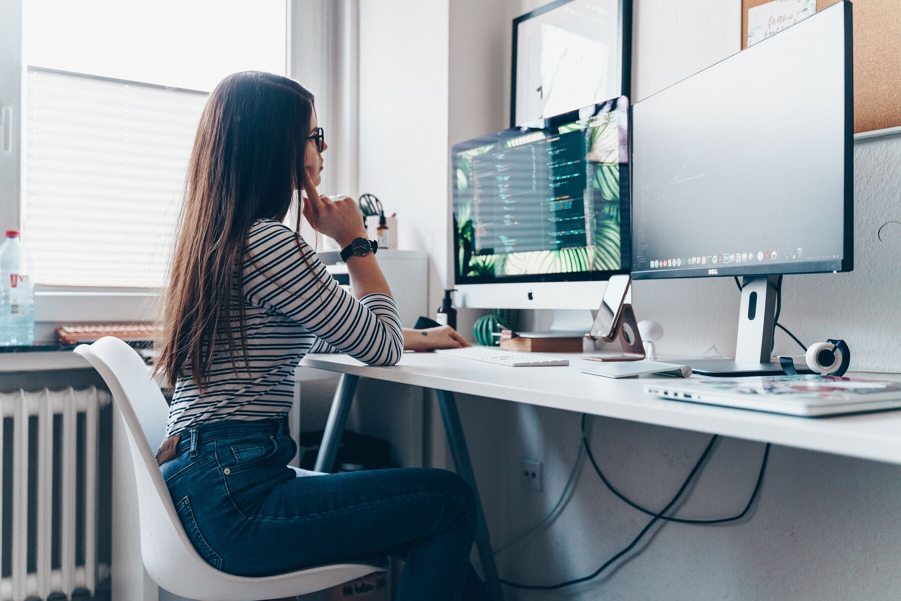 girl using desktop computer in room